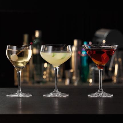 The SPIEGELAU Perfect Serve Collection cocktail glasses, all filled with specific cocktails. The Perfect Nick and Nora glass is on the left, followed by the Perfect Coupette glass and the Perfect Cocktail glass on the right side.<br/>
